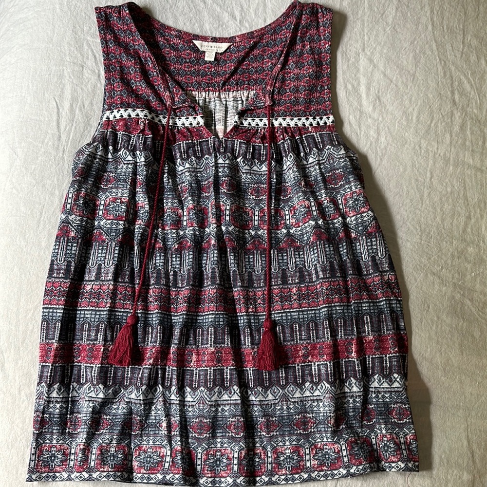 cool comfortable split neck tank with tassels